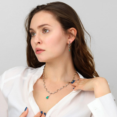 Kolczyki z białego i żółtego złota 585 ze szmaragdami... 2