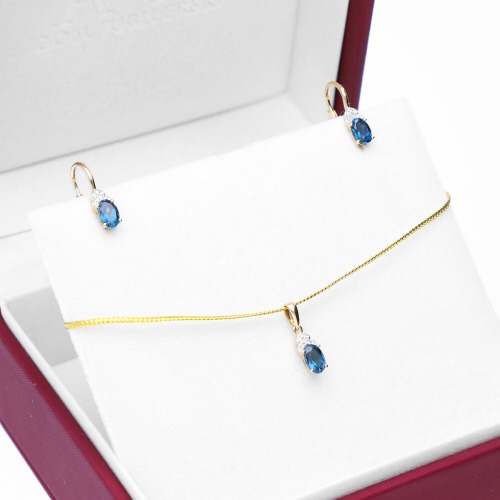 Zawieszka dwukolorowe złoto 585 z diamentami i topazem London Blue 0,57 ct