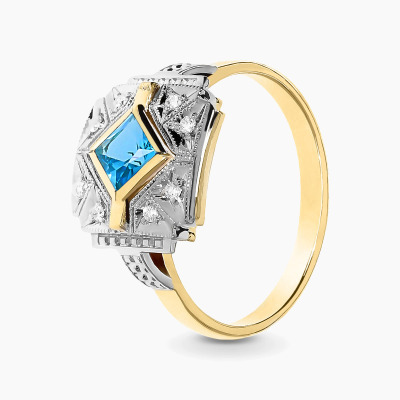 Pierścionek z dwukolorowego złota 585 z topazem 0,37 ct i...