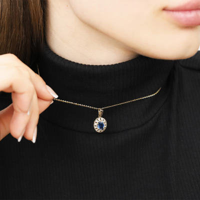 Zawieszka z dwukolorowego złota 585 z szafirem i brylantami 2