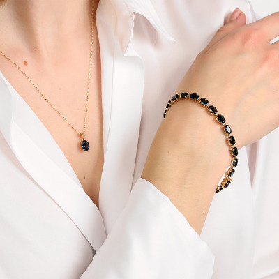 Bransoleta z żółtego złota 585 z topazami London Blue... 2